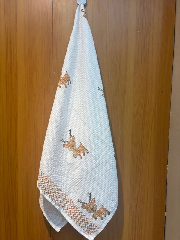 Rudy Reindeer waffle handblock printed baby towel with brown reindeer motifs – Newkasa.
Handblock printed waffle cotton baby towel featuring cute reindeer design – Newkasa.
Jaipuri waffle baby towel with reindeer print and chevron border – Newkasa.