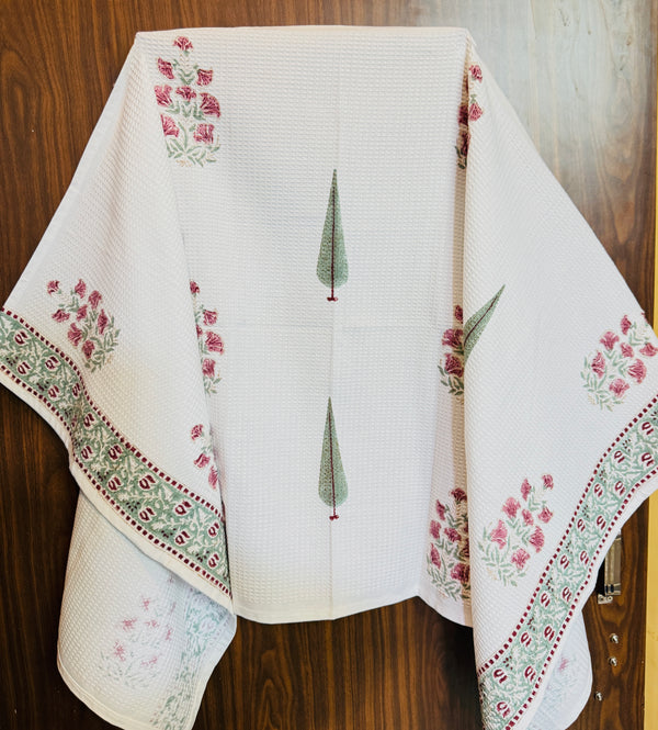 “Newkasa Gulnaar Jaipuri Hand Block Printed Cotton Waffle Bath Towel with pink floral and green cypress motifs, handcrafted in Jaipur Rajasthan — lightweight, soft, absorbent 100% cotton towel for spa, home, and resort use.”