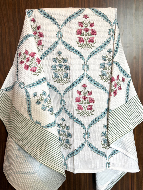 “Newkasa Raagini Jaipuri Hand Block Printed Cotton Waffle Bath Towel with rose pink and blue floral motifs, handcrafted in Jaipur Rajasthan — soft, absorbent, lightweight 100% cotton towel for spa, resort, and home use.”