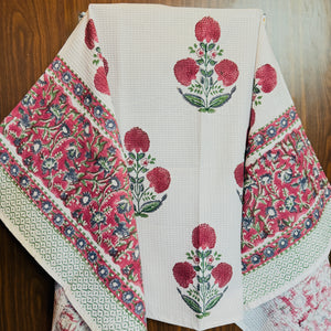 “Newkasa Gulmohar Jaipuri Hand Block Printed Cotton Waffle Bath Towel with red floral motifs and intricate borders, handcrafted in Jaipur Rajasthan — lightweight, absorbent, and 100% cotton towel for spa, resort, and home use.”