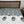 Bed with floral patterned bedspread and wooden headboard
